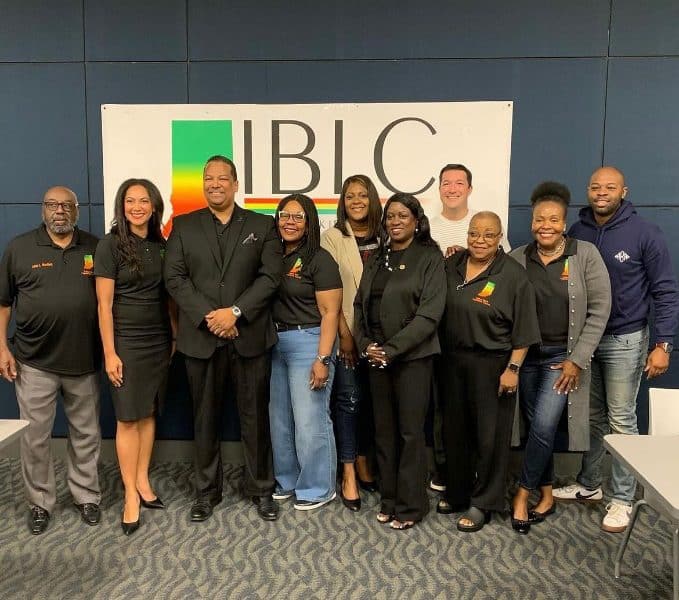 group of adults standing for a photo