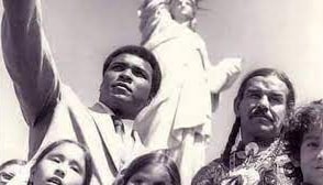 muhammad ali standing next to native american activists