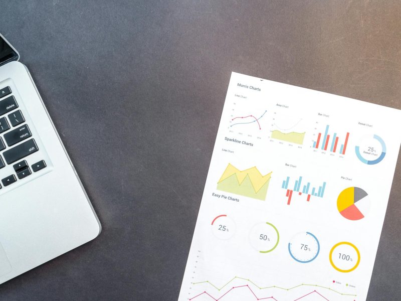 paper beside macbook